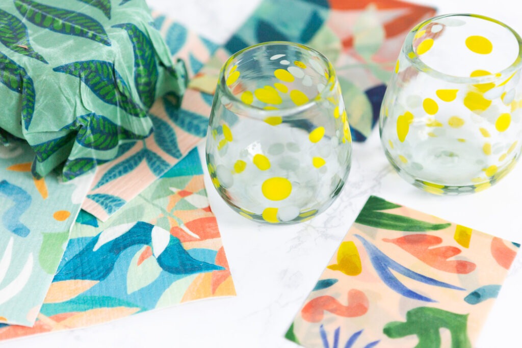 Glasses with yellow painted dots and cloths made from natural fibers